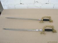 2 espadas mango de bronce
